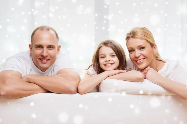 Smiling parents and little girl at home Royalty Free Stock Images