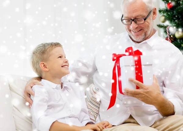 Smiling grandfather and grandson at home — Stock Photo, Image