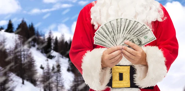 Nahaufnahme von Weihnachtsmännern mit Dollargeld — Stockfoto