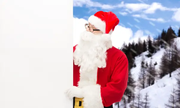Mann im Weihnachtsmannkostüm mit Werbetafel — Stockfoto