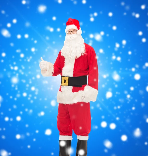 Man in costume of santa claus showing thumbs up — Stock Photo, Image