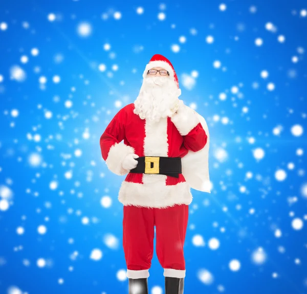 Man in costume of santa claus with bag — Stock Photo, Image