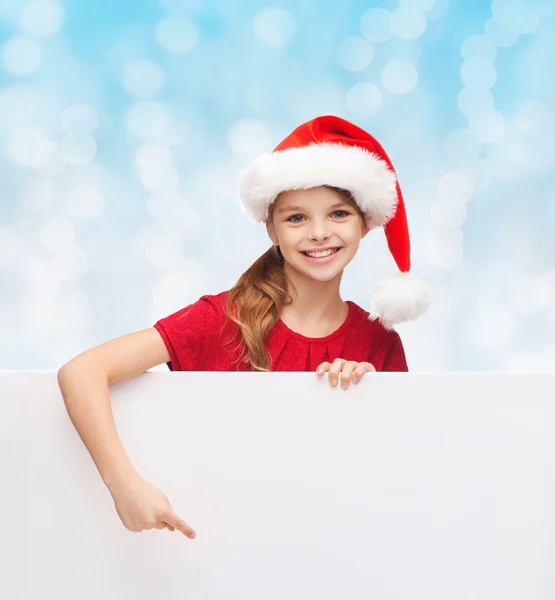 Fille dans santa helper chapeau avec tableau blanc vierge — Photo