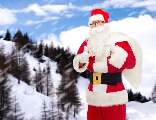 Homem em traje de santa claus com saco — Fotografia de Stock