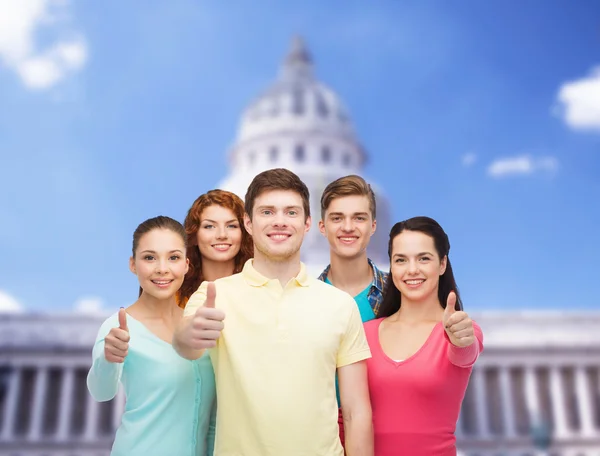 Group of smiling teenagers showing ok sign — Stock Photo, Image