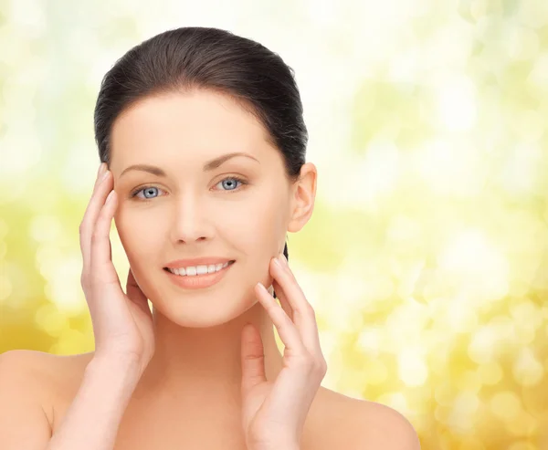 Beautiful young woman over yellow background — Stock Photo, Image