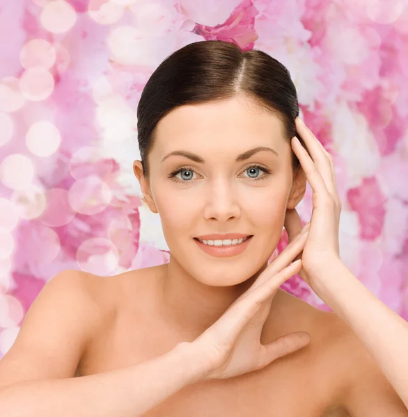 Smiling young woman with bare shoulders — Stock Photo, Image