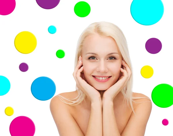 Beautiful young woman over polka dot background — Stock Photo, Image