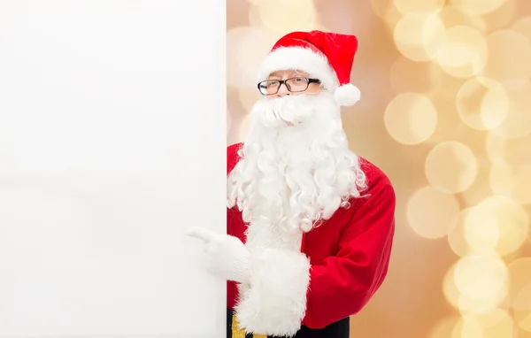 Man in costume of santa claus with billboard — Stock Photo, Image