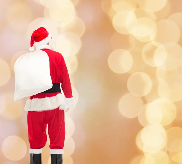 Man in costume of santa claus with bag — Stock Photo, Image