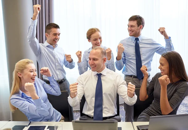 Business people celebrating victory in office — Stock Photo, Image