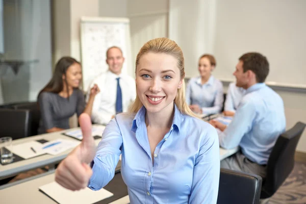 Group of smiling businesspeople meeting in office — Stock Photo, Image