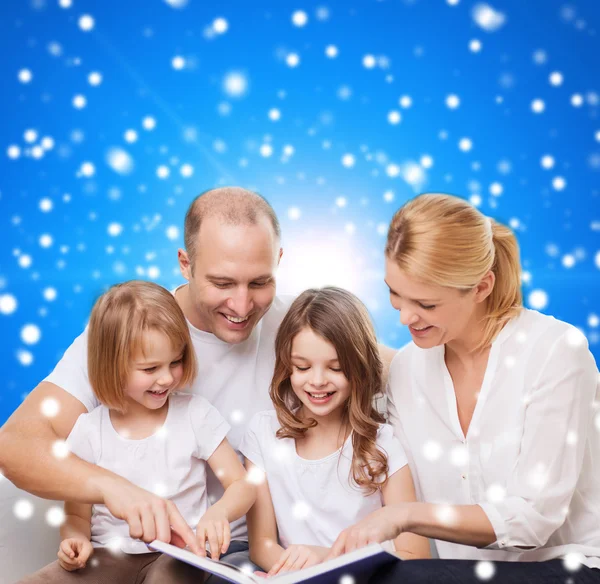 Happy family with book at home Royalty Free Stock Images