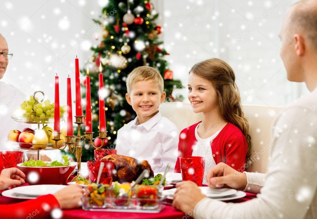 Smiling family having holiday dinner at home — Stock Photo © Syda