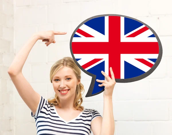 Smiling woman with text bubble of british flag — Stock Photo, Image