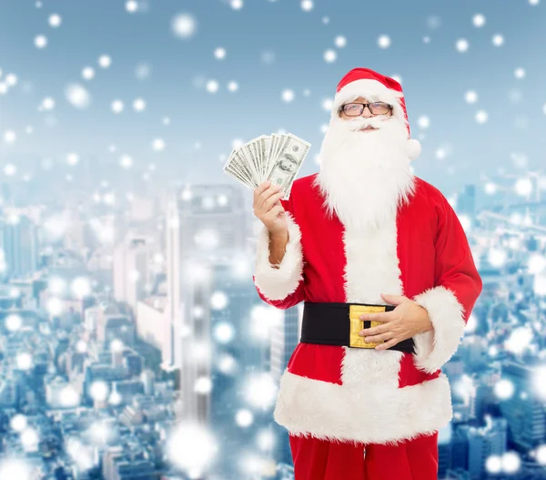 Man in costume of santa claus with dollar money — Stock Photo, Image