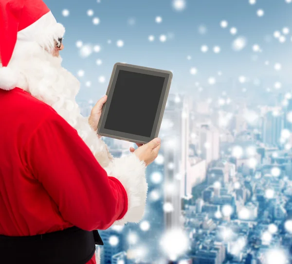 Man in costume of santa claus with tablet pc — Stock Photo, Image