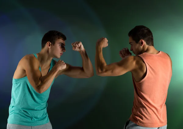 Young men fighting hand-to-hand — Stock Photo, Image