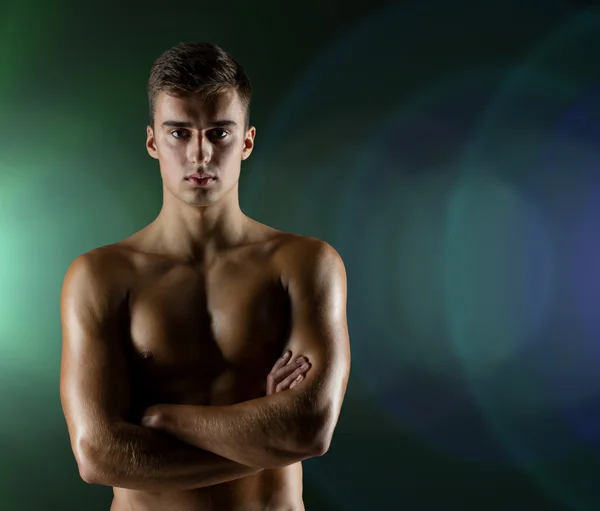 Young male bodybuilder with bare muscular torso — Stock Photo, Image