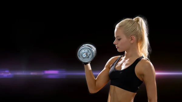 Young sporty woman with heavy steel dumbbell — Stock Photo, Image