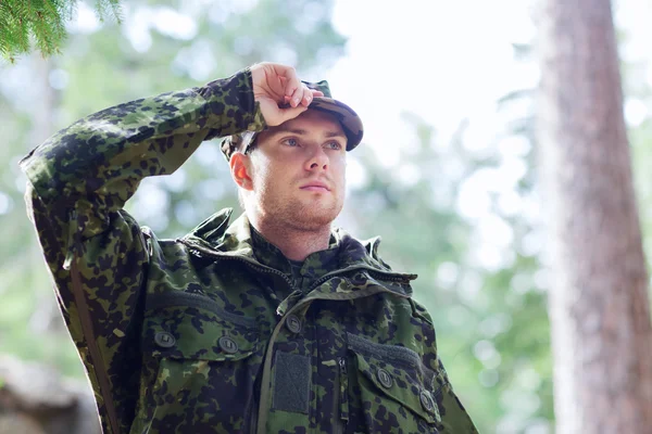 Young soldier or ranger in forest — Stock Photo, Image