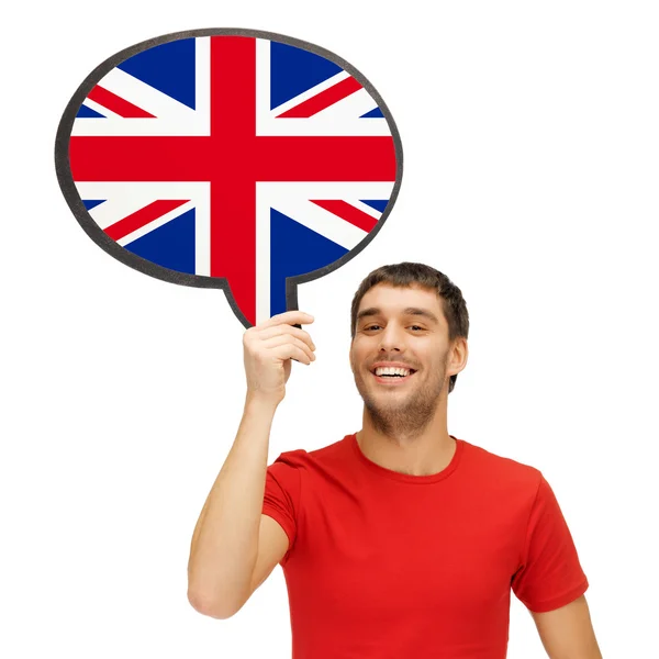 Smiling man with text bubble of british flag — Stock Photo, Image