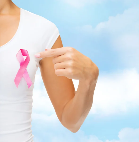 Close up of woman with cancer awareness ribbon — Stock Photo, Image
