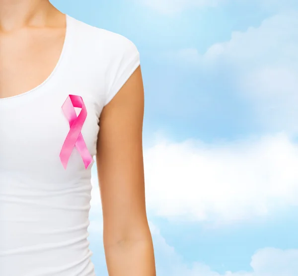 Close up of woman with cancer awareness ribbon — Stock Photo, Image