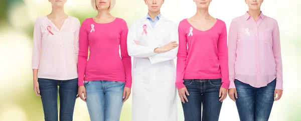 Close up of women with cancer awareness ribbons — Stock Photo, Image