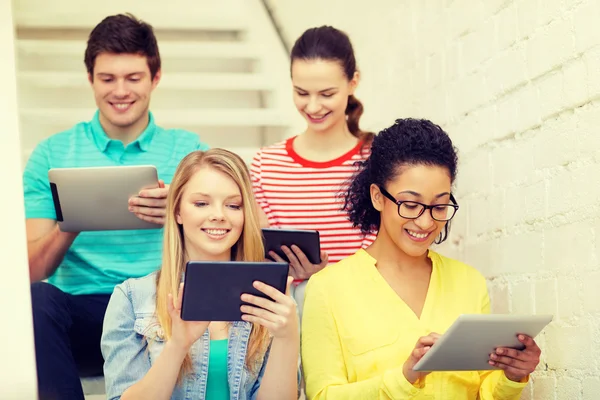 Smiling students with tablet pc computer — Stock Photo, Image