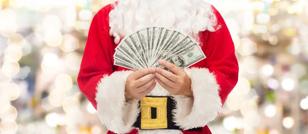 Primer plano de santa claus con dinero en dólares — Foto de Stock