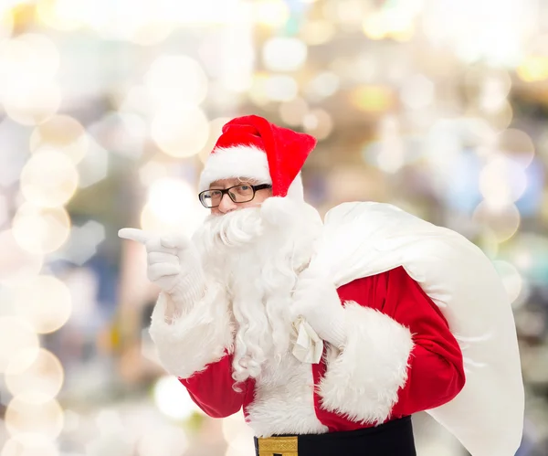 Man in costume of santa claus with bag — Stock Photo, Image