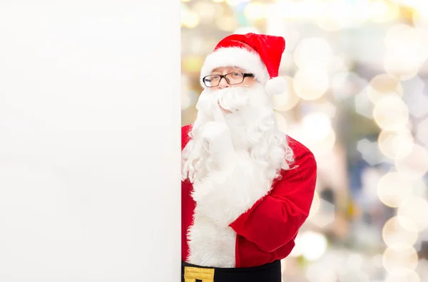 Man in costume of santa claus with billboard — Stock Photo, Image