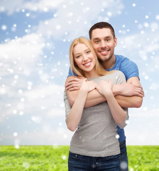 Happy couple hugging outdoors — Stock Photo, Image