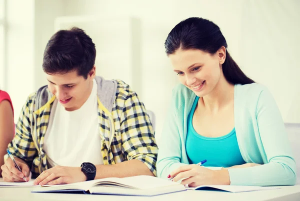 Students with textbooks and books at school — Stock Photo, Image