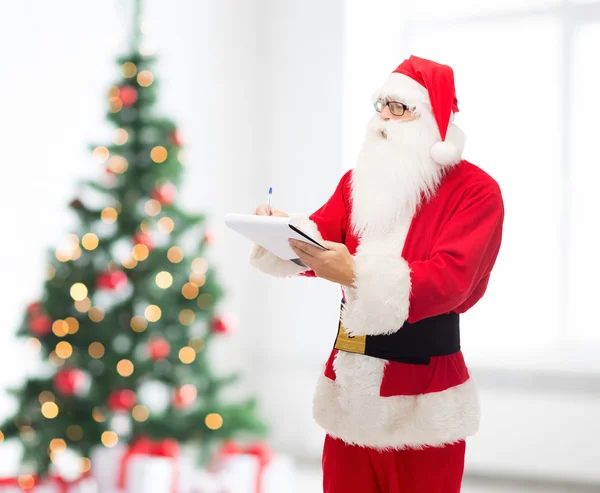 Adam Noel Baba kostüm ile not etmek — Stok fotoğraf