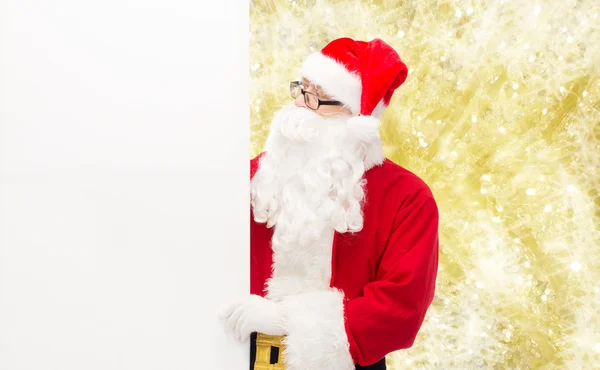 Mann im Weihnachtsmannkostüm mit Werbetafel — Stockfoto