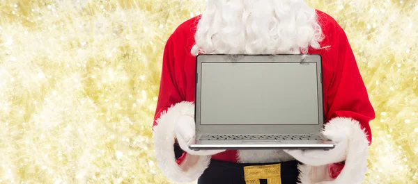 Close up of santa claus with laptop — Stock Photo, Image