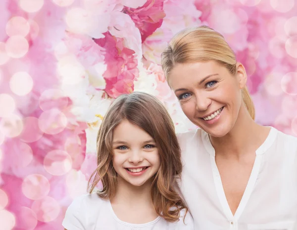 Smiling mother and little girl — Stock Photo, Image