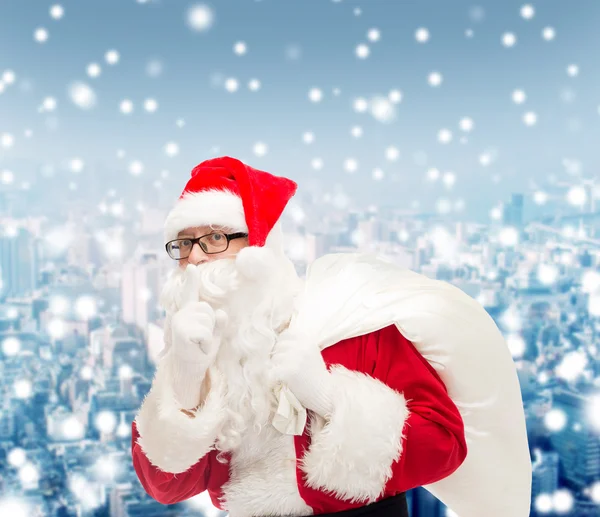 Homme en costume de Père Noël claus avec sac — Photo