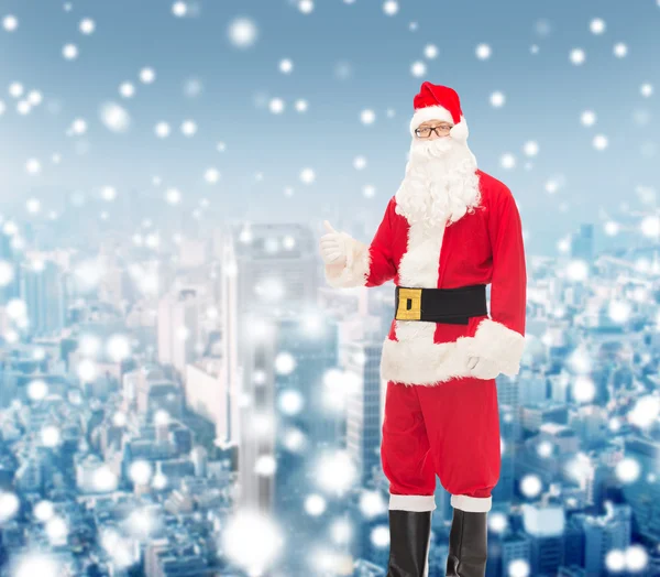 Man in costume of santa claus showing thumbs up — Stock Photo, Image