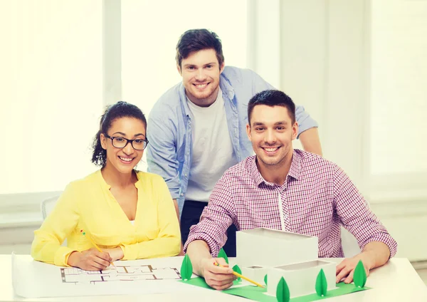Smiling architects working in office Stock Picture