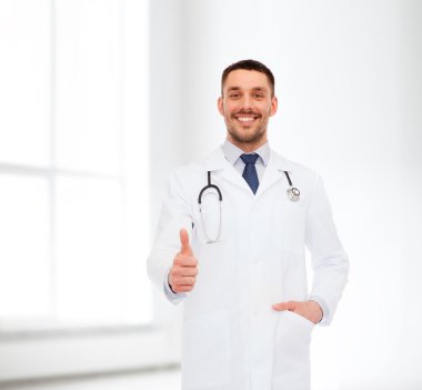 smiling doctor with stethoscope showing thumbs up clipart