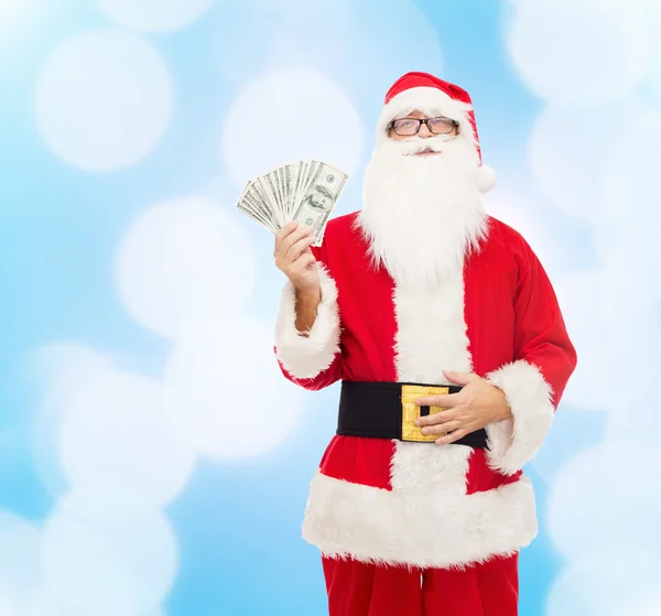 Hombre disfrazado de santa claus con dinero en dólares — Foto de Stock