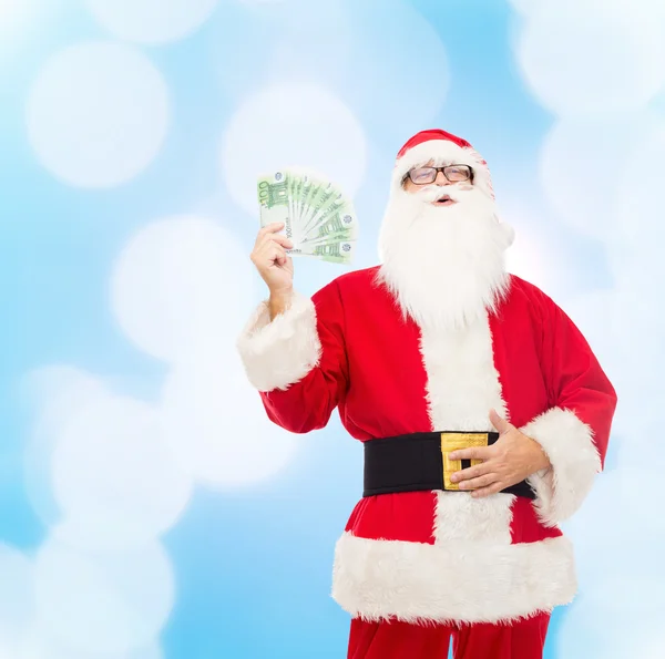 Man in costume of santa claus with euro money — Stock Photo, Image