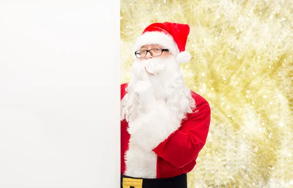 Man in costume of santa claus with billboard — Stock Photo, Image