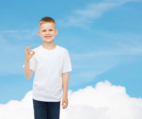 Smiling little boy in white blank t-shirt — Stock Photo, Image