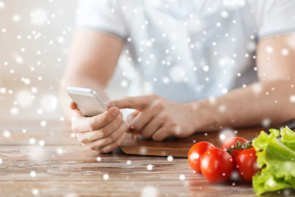 Closeup of man reading recipe from smartphone — Stock Photo, Image