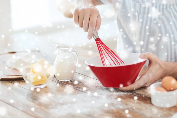 Close up of man whipping something in bowl — Stock Photo, Image