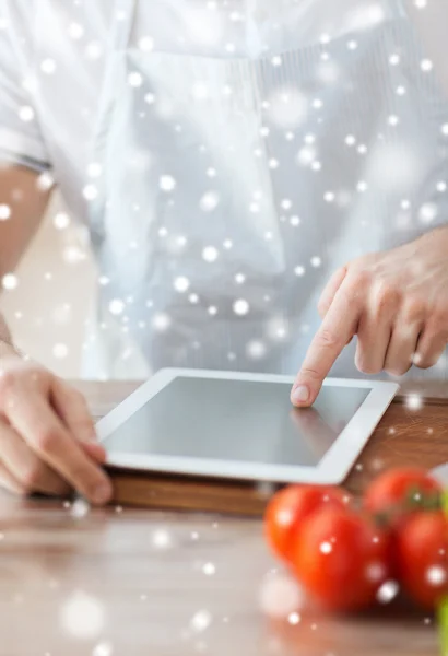 Closeup of man reading recipe from tablet pc — Stock Photo, Image